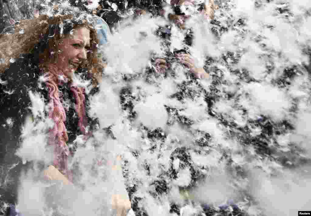 Participants join a mass pillow fight in Trafalgar Square in central London. 