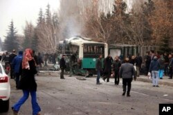 A destroyed public bus at the scene of a car bomb attack in central Anatolian city of Kayseri, Turkey, Saturday, Dec. 17, 2016.