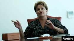 Brazil's President Dilma Rousseff gestures during a meeting at the Planalto Palace in Brasilia, Sept. 17, 2013. 