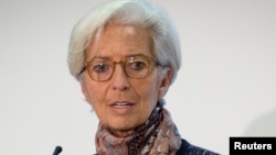 FILE - Managing Director of the International Monetary Fund Christine Lagarde speaks at a press conference at the Treasury in London, Dec. 11, 2015.