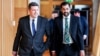 First Minister of Scotland Humza Yousaf, right, arrives with Parliament Member Jamie Hepburn at the Scottish Parliament in Edinburgh on April 30, 2024. Yousaf said Monday he would resign, and a no-confidence vote on the Scottish government will take place Wednesday.