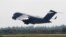 A C-17 cargo plane loaded with humanitarian commodities takes off from Homestead Air Reserve Base in route to Venezuela, Saturday, Feb. 16, 2019, in Homestead, Fla. 