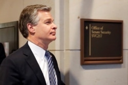 FILE - FBI Director Christopher Wray departs following a briefing for congressmen about Russian election interference, March 10, 2020, on Capitol Hill in Washington,