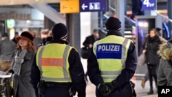 Police patrol in the main train station in Cologne, Germany, Jan. 18, 2016. Authorities have arrested a 26-year-old Algerian man on suspicion of committing a sexual assault in Cologne during New Year's celebrations.