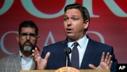 FILE - Florida Gov. Ron DeSantis speaks at the Doral Academy Preparatory School in Doral, Fla., Sept. 14, 2021.