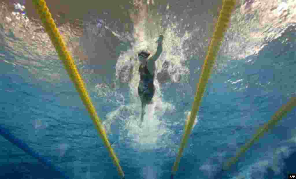 Amanda Kendall, of the United States, is all alone as she swims ahead of the pack during the last leg of the finals for the women's 4x100m medley relay swimming event at the Pan American Games in Guadalajara, Mexico, Friday, Oct. 21, 2011. The United Stat