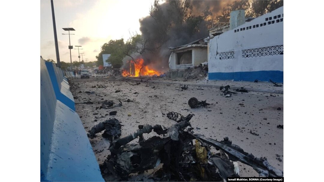 Debris litters a Mogadishu street after a car bomb exploded next to a restaurant in the Somali capital, May 24, 2017, killing eight people and injuring 15.