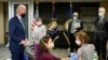 FILE - President Joe Biden, left, visits a COVID-19 vaccination site at the VA Medical Center in Washington, D.C., March 8, 2021.