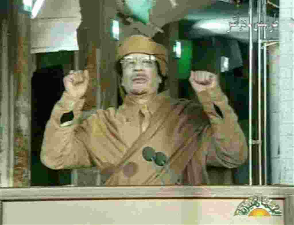 This image broadcast on Libyan state television Tuesday, Feb. 22, 2011, shows Libyan leader Moammar Gadhafi as he addresses the nation in Tripoli, Libya. Libya's Gadhafi vowed to fight on against protesters demanding his ouster and die as martyr. (AP Phot