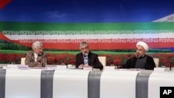 Presidential candidates from left: Saeed Jalili, Iran's top nuclear negotiator, Gholam Ali Haddad Adel, parliament lawmaker, and Hasan Rowhani, former top nuclear negotiator, attend TV debate, Tehran, June 7, 2013.