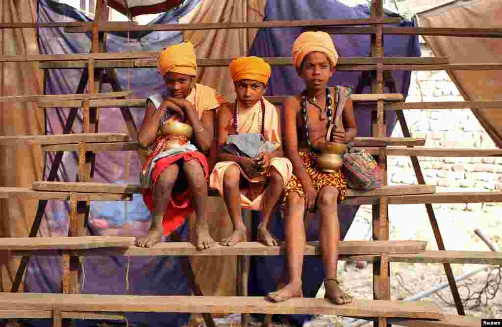 Young Hindu priests watch a circus at a fair on the outskirts of Jammu, India.