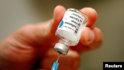 A nurse prepares an injection of the influenza vaccine at Massachusetts General Hospital in Boston, Massachusetts, Jan. 10, 2013.