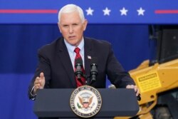 FILE - Vice President Mike Pence speaks at a campaign event on the grounds of Kuharchik Construction, Inc., in Exeter, Pa., Sept. 1, 2020.