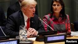 U.S. President Donald Trump speaks as U.N. Ambassador Nikki Haley looks on at the United Nations Global Call to Action on the World Drug Problem during the 73rd U.N. General Assembly in New York, Sept. 24, 2018. 