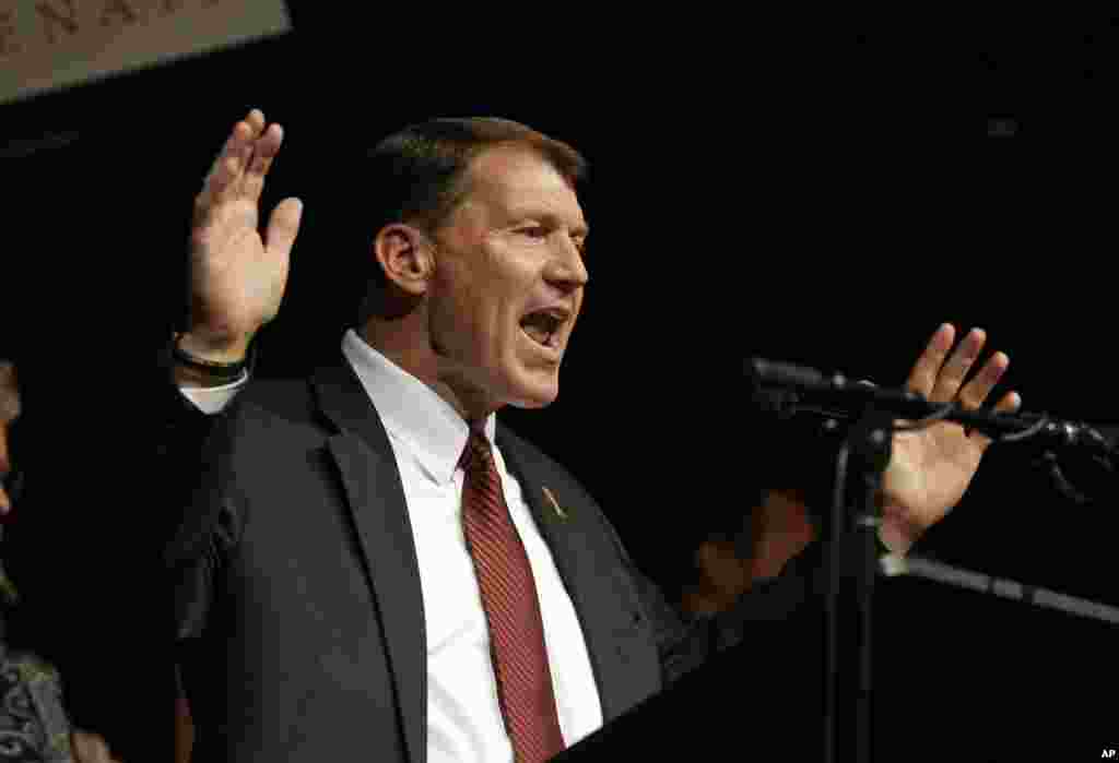 Republican Mike Rounds celebrates with supporters after winning South Dakota Senate race at an election night party in Sioux Falls, Nov. 4, 2014.