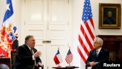 U.S. Secretary of State Mike Pompeo speaks with Chile's President Sebastian Pinera