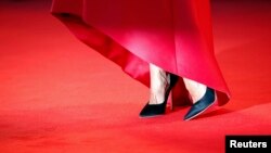 The shoes of a model appear on the red carpet ahead of the screening of "La Rancon de la gloire" (The Price of Fame), 71st Venice Film Festival, Aug. 28, 2014.