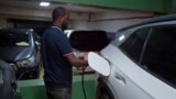 A driver charges his electric car at a charging station in Addis Ababa, Ethiopia Thursday, Oct. 3, 2024. (AP Photo)