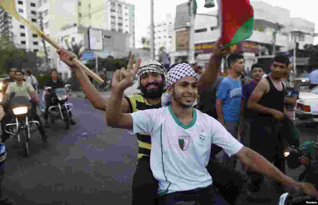 Palestinians celebrate in Gaza City, Aug. 26, 2014.