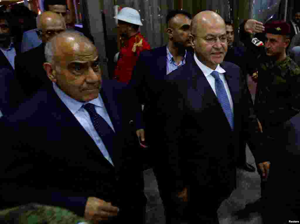 حضور &laquo;بَرهَم صالح&raquo; رئیس جمهوری جدید عراق به همراه عادل عبدالمهدی گزینه پیشنهادی برای نخست وزیری آن کشور در پارلمان عراق در بغداد
