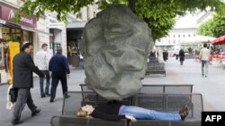 Asthmatics feel like something heavy is on their chest during an attack, as demonstrated in Geneva for World Asthma Day in 2009