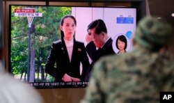 FILE - A man watches a TV screen showing a news program with a file image of Kim Yo Jong, the sister of North Korea's leader Kim Jong Un, at the Seoul Railway Station in Seoul, South Korea, June 4, 2020.