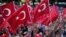 Pro-government demonstrators wave Turkish flags as they protest against the attempted coup in Istanbul, Turkey, July 19, 2016. The Turkish government accelerated its crackdown on alleged plotters of the failed coup against President Recep Tayyip Erdogan.