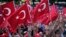 Pro-government demonstrators wave Turkish flags as they protest against the attempted coup, in Istanbul, Turkey, July 19, 2016. The Turkish government accelerated its crackdown on alleged plotters of the failed coup against President Recep Tayyip Erdogan.