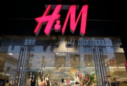 FILE - This May 31, 2013 file photo shows the exterior of an H&M store in New York. (AP Photo/Mark Lennihan, File)