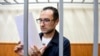 FILE - Eugene Spector, Russian-born U.S. citizen already imprisoned in Russia on a bribery stands behind bars in a courtroom in Moscow, Russia, Feb. 20, 2020. Spector has been handed a second 15-year jail term for espionage, Russian news agencies reported on Dec. 24, 2024.