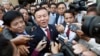 FILE - Kem Sokha, center, speaks to reporters outside the Phnom Penh Municipality Court, April 8, 2015. An anti-terror official says Kem Sokha will most likely be questioned about audio recordings related to an alleged affair.