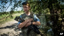 An official uses a telescope to perform "rukyah", the sighting of the new moon for the Muslim holy fasting month of Ramadan, in Putrajaya, Malaysia.