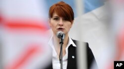 FILE - Maria Butina speaks at a rally in support of legalizing the possession of handguns, in Moscow, Russia, April 21, 2013. 