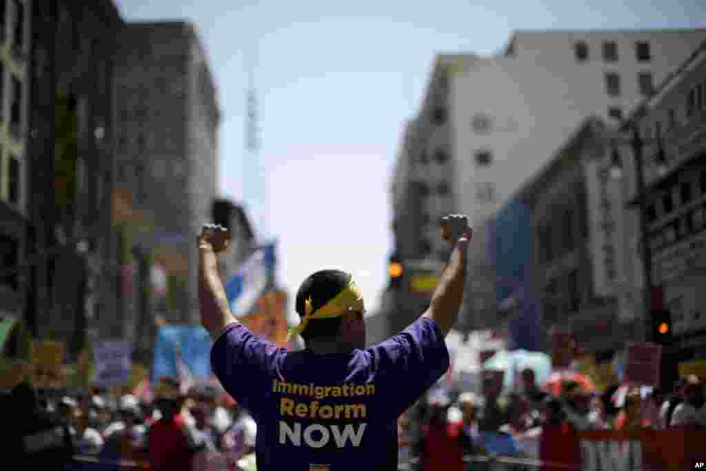 Marchers walk during an immigration reform rally in downtown Los Angeles, California, May 1, 2013. 