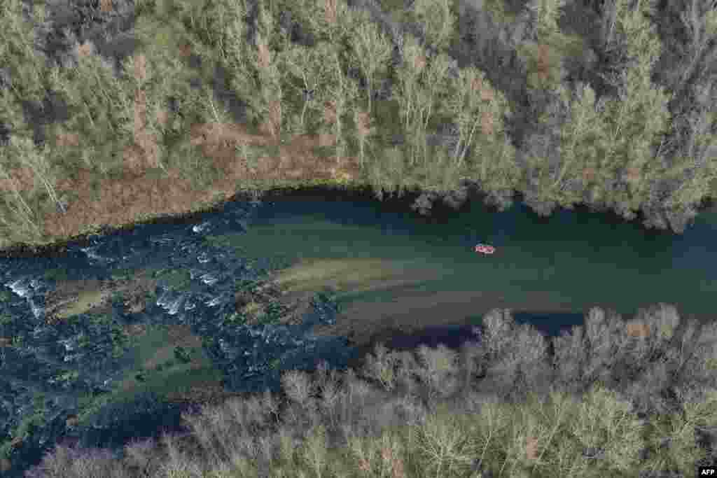 This aerial picture shows people rafting on Nestos river near the northern Greek city of Drama.