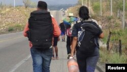 FILE - Central American migrants arrive at in Ixtepec, Oaxaca, Mexico, before continuing their journey to the United States, March 30, 2018.