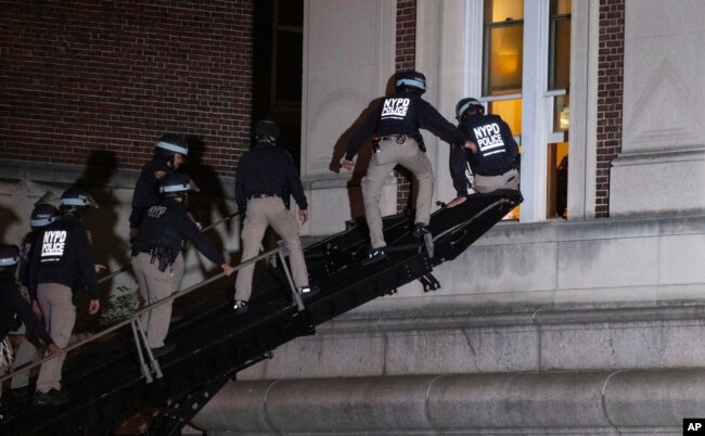 Using a tactical vehicle, New York City police enter an upper floor of Hamilton Hall on the Columbia University campus in New York Tuesday, April 30, 2024, after a building was taken over by protesters earlier Tuesday. (AP Photo/Craig Ruttle)