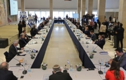 FILE - This picture taken on May 24, 2020, shows a general view of a Cabinet meeting of the new Israeli government at Chagall State Hall in the Knesset (Israeli parliament) in Jerusalem.