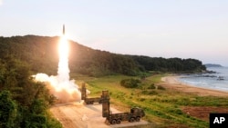 In this photo provided by South Korea Defense Ministry, South Korea's Hyunmoo II ballistic missile is fired during an exercise at an undisclosed location in South Korea, Sept. 4, 2017. 