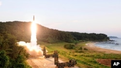 In this photo provided by South Korea Defense Ministry, South Korea's Hyunmoo II ballistic missile is fired during an exercise at an undisclosed location in South Korea, Sept. 4, 2017.