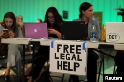 Volunteer lawyers set up a table to help arriving passengers following the reinstatement by the U.S. Supreme Court of portions of President Donald Trump's executive order targeting travelers from six predominantly Muslim countries, at Los Angeles International Airport, California, June 29, 2017.