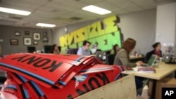 A box full to the brim with KONY 2012 campaign posters are shown Thursday March 8, 2012 at the Invisible Children Movement offices in San Diego. 