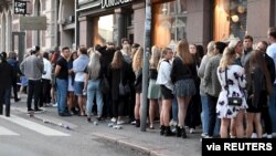 Young people wait to enter a night club in Helsinki, Finland, July 15, 2020.