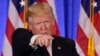 Presiden AS terpilih Donald Trump menerima pertanyaan-pertanyaan dalam konferensi pers di New York (11/1). (AP/Seth Wenig)