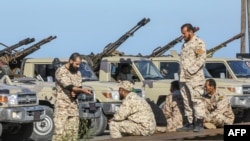 Forces loyal to Libya's U.N.-backed unity government arrive in Tajura, a coastal suburb of the Libyan capital, Tripoli, April 6, 2019, from their base in Misrata. 