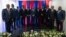 FILE - Members of the Haiti Transitional Council pose for a group photo during an installation ceremony, in Port-au-Prince, Haiti, April 25, 2024.