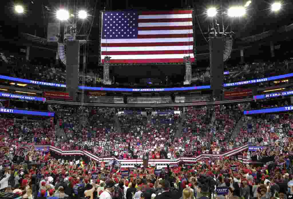 U.S. President Donald Trump, center, speaks to supporters where he formally announced his 2020 re-election bid, June 18, 2019, in Orlando, Florida.