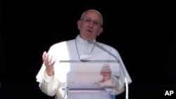 Pope Francis celebrates the Angelus noon prayer from the window of his studio overlooking St. Peter's Square, at the Vatican, March 6, 2016. The pontiff said the four nuns killed Friday in an attack on a home in Yemen are modern-day martyrs and victims of indifference.