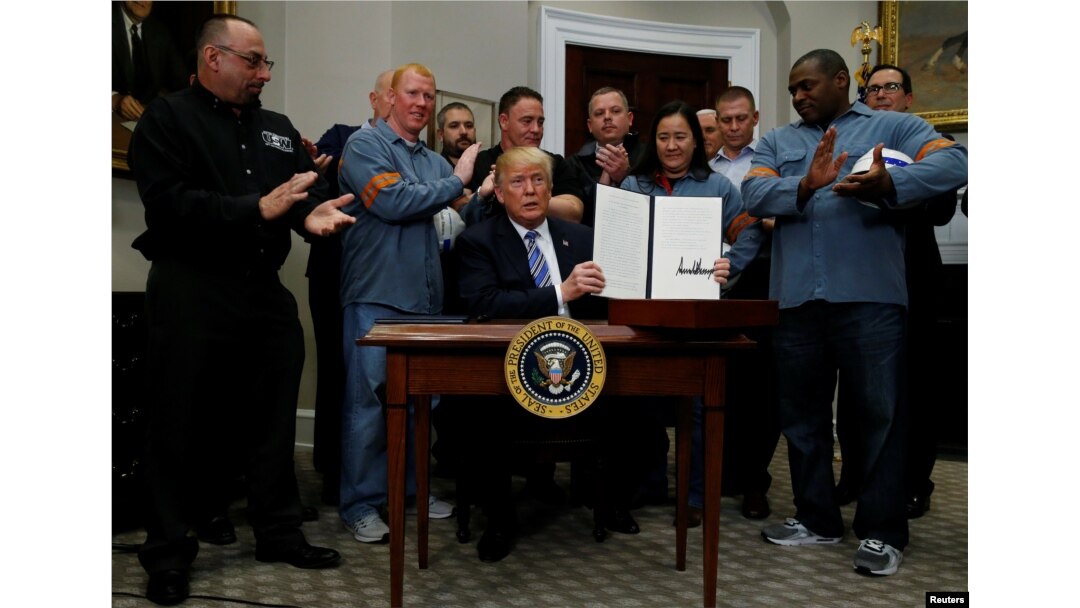 FILE - U.S. President Donald Trump is after signing a proclamation to establish tariffs on imports of steel and aluminum at the White House in Washington, U.S., March 8, 2018. REUTERS/Leah Millis