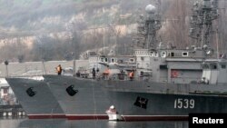 Russian military vessels are anchored at a navy base in the Ukrainian Black Sea port of Sevastopol in Crimea, Feb. 27, 2014.